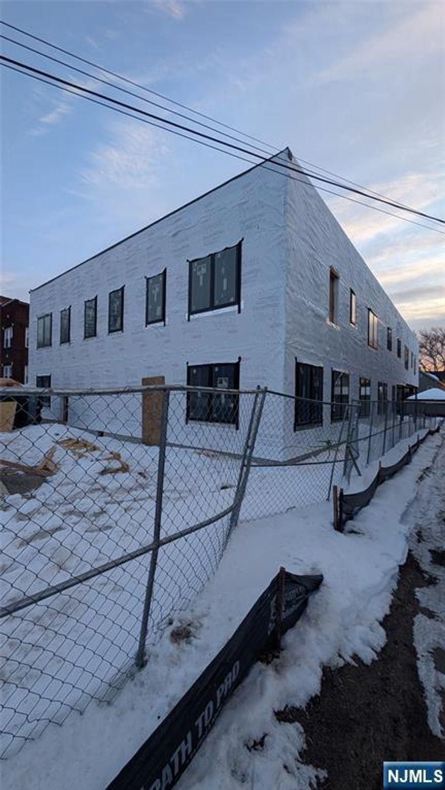 Investor / Builder Special in Rutherford. A 6-unit residential new construction project being sold at end of framing stage with framing complete, roof installed, windows in, house wrap done, and plumbing rough started. Each unit is designed as 2 Bed / 2 Bath (~1,250 SF each) with rear parking for 12 cars and EV charger setup. Prime commuter location just a few blocks to the Rutherford train station and directly in front of a bus line to NYC. Offered at $2,500,000 as-is with approximately $1M needed to complete and a projected after-built value of ~$4,000,000, creating substantial built-in equity and upside potential. Step into a nearly vertical build and finish with instant value. Builder is willing to complete construction for the new owner. Plans and approvals available â€” serious investors, developers, and 1031 exchange buyers only.