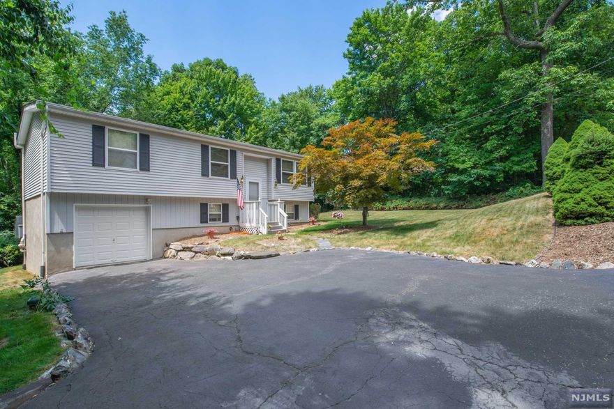 Beautifully Maintained Bi-Level on Landscaped Lot Surrounded by Nature with Storage Shed and Patio Area for Entertaining. Newer Roof and Carpeting Have Been Added to This 3 Bedroom Home. The Basement is Partially Finished with laundry and Access to One Car Garage! Come Take a Look, Your Buyers Won't Be Disappointed! Upper Greenwood Lake Community Offers Members Only Beach & Clubhouse, Motor Boating, Kayaking, Swimming, Fishing, Jet Skiing & More Plus Year Round Activities! Just 1 Hour To NYC & Close To Major Highways, Shopping, Dining, Golf Courses, Ski Resorts, Wineries, Apple Orchards, Drive-In Theater & So Much More!