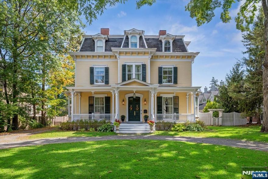 A world of luxury, elegance, and prestige. Stunning 1862 Victorian incorporates 21st-century updates while maintaining its timeless character, all set on a beautifully landscaped 1/2 acre lot. Blocks from NJ direct train to NYC, downtown shops, restaurants, schools, and Morristown Airport. Hardwood floors and soaring 12ft ceilings flow throughout the home, crown moldings, detailed trim, 5 fireplaces, and a finished basement. The living room with fireplace opens to an elegant dining room and a spacious butler's pantry, perfect for entertaining. The gourmet chef's kitchen features warm custom cabinetry, granite counters, high-end appliances, and a walk-in pantry, with a breakfast nook that seamlessly connects to the inviting gathering room. Completing the floor are a powder room, laundry room, and a distinguished office with built-in shelving and fireplace. The second floor hosts the primary suite with 2 custom WIC and a palatial en suite bath. 2 additional bedrooms share a convenient Jack-and-Jill bathroom, while the third floor offers 4 more bedrooms, a full bath, and excellent storage. The finished LL includes a cozy recreation room, exercise area, wine cellar, 1/2 bath, and storage. Outdoors, a private fenced-in yard with a patio that provides the perfect backdrop for entertaining. Beyond, a fully renovated carriage house adds comfort and versatility. This exceptional residence offers not only grandeur and history, an extraordinary opportunity in the heart of Morristown.