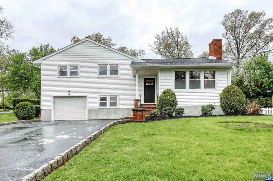 This exceptional home offers a sprawling interior with numerous amenities and modern features that will appeal to those looking for a comfortable and stylish living space. The four bedrooms and 2.5 bathrooms offer ample space for a family or guests, while the newly installed kitchen with stainless steel appliances and quartz countertops is a standout feature that will undoubtedly impress. The ground floor with a powder room and a French door leading to the backyard offers great space for entertaining, while the legal bedroom in the basement makes it perfect for accommodating guests or setting up a home office or gym. The backyard with a large patio, in-ground pool, and playground offers a great space to enjoy the outdoors and entertain guests. This home offers a suburban atmosphere with all the modern features you could want, making it a fantastic choice for anyone looking for an updated, comfortable living space. Minutes from school, NY Bus, Parks, Shopping and houses of worship.