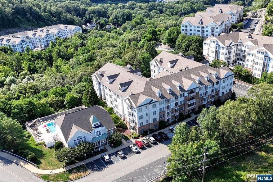 WELCOME TO THE GRANDE! Lots of Amenities to enjoy all nestled in the mountains and ultimate convenience of location for easy commute, shopping, restaurants, hiking etc. THIS UNITS LOCATION IS GREAT WITH ONE OF THE COMPLEXES 2 POOLS RIGHT NEXT TO THIS BUILDING! Once you arrive take the ELEVATOR to this beautiful 1 Bedroom, 1 Bath condo on the 3rd Floor! Enjoy this larger 1 bedroom unit which features the extra DEN, currently being used as a dining room but can be office, guest space whatever you need). Beautifully kept and neat as a pin! Great sized kitchen with large Breakfast bar/Counter, Granite Counters, SS appliances and tons of room to whip up the best meals! Private balcony off living room to enjoy the fresh air! This unit includes 1 assigned parking space in the garage below and plenty of extra parking available! The Grande Life offers many amenities including 2 POOLS, 2 CLUBHOUSES, TENNIS COURTS, FITNESS CENTER, BILLIARDS ROOM, CONFERENCE ROOMS. Pets welcome with restrictions of 2 pets max per unit /less than 35 lbs per pet!