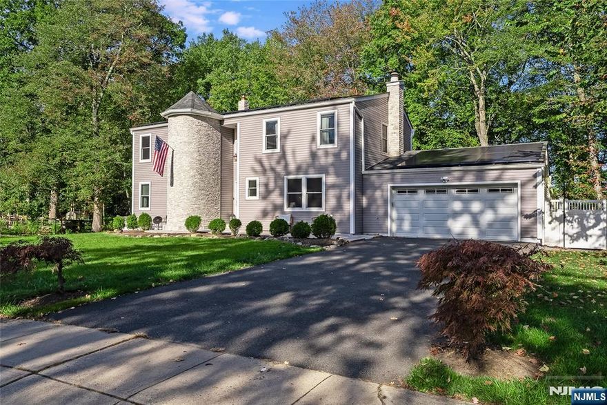 Experience modern sophistication at its finest in this impeccably renovated 4-bedroom, 2.5-bath home set on nearly a half acre in sought-after West Caldwell. A dramatic two-story foyer welcomes you into a space where design and comfort effortlessly intertwine. The chic formal living room exudes style with its clean lines and designer finishes, while the adjacent living area features a striking fireplace that adds warmth and character to the home's modern aesthetic. The show-stopping kitchen showcases black stainless-steel appliances, quartz countertops, a breakfast peninsula, and open sightlines to the dining and living spaces perfect for gatherings both large and intimate. Upstairs, the serene primary suite offers a private retreat with custom closets and a spa-inspired en suite bath, while three additional bedrooms provide generous space and natural light. The fully finished lower level adds versatility for work, wellness, or recreation. Outside, a fenced backyard with a deck and patio extends the home's sophisticated style, creating the perfect setting for al fresco entertaining. Complete with a two-car garage and a premier location near top-rated schools, vibrant downtowns, and NYC access, this residence embodies refined living with timeless appeal.