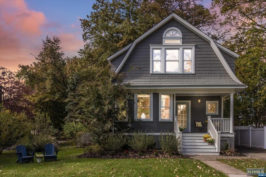 This enchanting Dutch Colonial charmer with the most delightful front porch, is situated only 1/4 mile from direct NYC train service. Also nearby is vibrant Upper Montclair Village, parks, playgrounds, tennis courts, the famous Presby Iris Gardens, 150 acre Mills Reservation, and Montclair's favorite sledding hill! A tranquil, meticulously landscaped backyard with a pretty bluestone patio, offers a peaceful haven for relaxing, gardening, and year-round gatherings around the firepit. A cheerful, warm interior, with high ceilings, is flooded with sunlight, and features an original leaded glass window, optional 1st floor bedroom, central AC, and ample closets and storage. Be ready to fall in love!