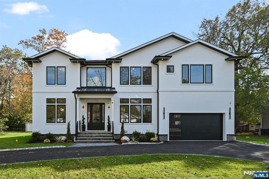 Welcome to this stunning 6-bed, 6.5-bath custom new construction home offering approx. 5,100+ sq ft of finished living space across 3 expansive levels, ideally situated on a 0.35 acre FLAT lot with Circular Driveway. The main floor is thoughtfully designed for modern living & entertaining, with a Covered Front porch entry into a dramatic 2-story foyer. Wide-plank HW floors & detailed custom trim set the tone throughout. The formal dining room flows seamlessly into the chef's kitchen, featuring high-end stainless steel appliances, quartz countertops, a center island with seating, a walk-in pantry, & a butler's pantry. The open-concept layout continues into the spacious Family room with 20ft Ceiling family room, anchored by an electric fireplace with Stone cladding & sliders open to a paver patio, a private guest suite w/ full bath, mudroom, powder room & convenient access to a two-car garage. Upstairs, the luxurious primary suite serves as a peaceful retreat with a private balcony, large designer WIC, & a spa-like bath feat. double vanities, a soaking tub, glass-enclosed shower. Three additional bedrooms are all en-suite, each w/ custom WIC; a laundry room with built-in cabinetry & sink for added convenience. The fully finished basement offers a large recreation room with a Wet Bar, media room, Exercise/Gym/Office room, 6th bedroom, full bath, & ample storage. 10-Year Builder's Warranty