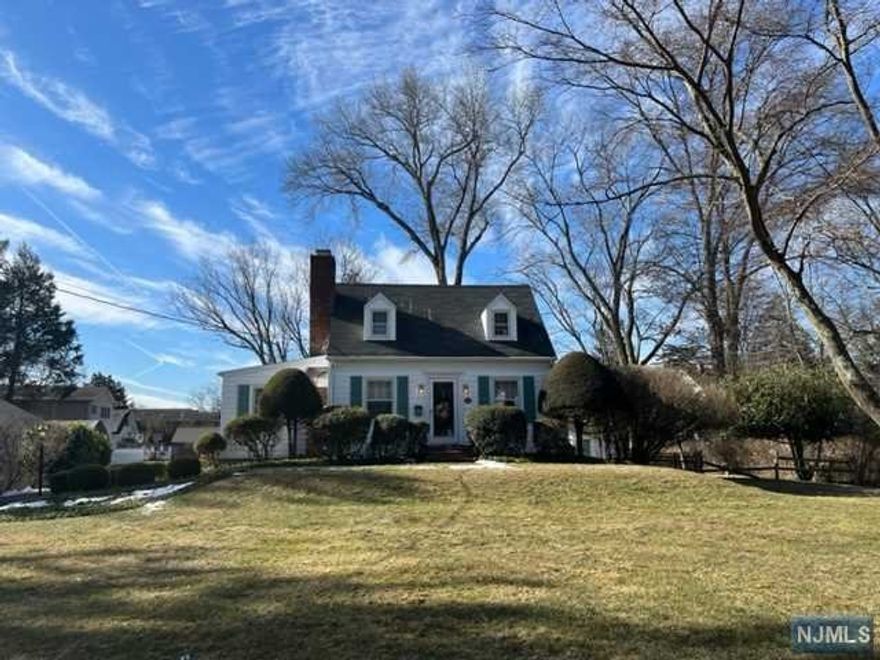 Welcome to this charming Wyckoff colonial situated on almost half an acre of lovely property. Perfect to renovate, expand or to live in and enjoy as is. This special home that has been tastefully decorated and lovingly maintained, features a gracious front to back formal living room with a wood burning fireplace, cedar closet and hardwood floors, a cozy den and an updated spacious kitchen with stainless appliances, beamed ceiling and a lovely dining area with picturesque bow window. The second floor provides a pretty master bedroom, cedar closets, second bedroom and full bath with the shower over the tub. The laundry area with sink plus storage and utilities completes the full, unfinished basement. An attached one car garage plus a darling playhouse/potting shed and brick patio highlight the large, level back yard. Conveniently located to Wyckoff's downtown shopping, restaurants, grammar school and NYC bus plus low taxes makes this your perfect find! House "as is".