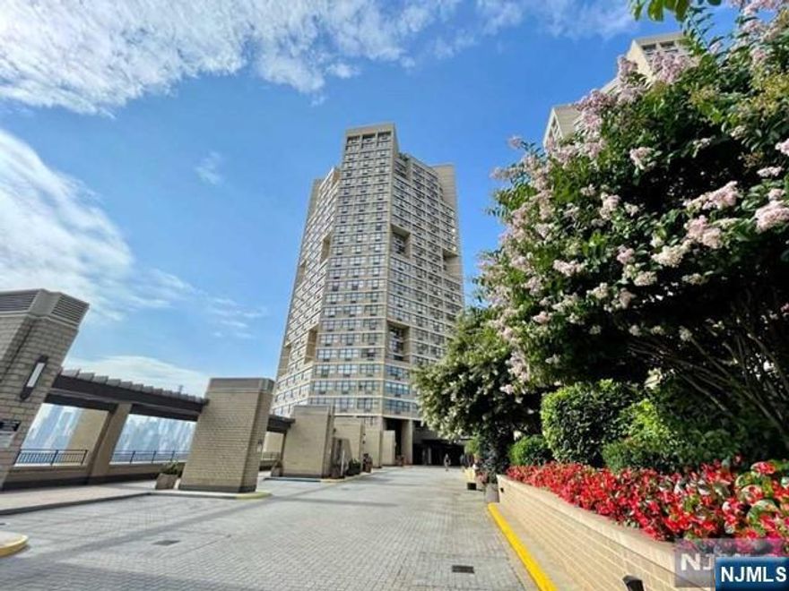 *Contact WENDY GAMEZ 917-504-3347 for a tour* One of the largest one-bedroom residences at the iconic Galaxy Towers, Residence 11E offers approximately 870 square feet of refined living with all utilities included. This bright, move-in-ready home features an expansive, sun-filled open layout and a fully equipped modern kitchen designed for both style and functionality. Residents enjoy a premier resort-style lifestyle with indoor and outdoor pools, a state-of-the-art fitness center with a dedicated weight room, sauna, tennis courts, library, and 24-hour concierge service, complemented by premium on-site conveniences including a deli, spa, pharmacy, and dry cleaner. Ideally located for effortless commuting, the Port Imperial Ferry is just five minutes away, with express bus service to Manhattan approximately ten minutes from your door. Annual taxes are $5,297.33. Monthly HOA of $1,078 includes water, hot water, sewer, gas, heat, and electric. Parking is available at $120/month. A rare opportunity to own a spacious, full-service residence offering elevated comfort, convenience, and lifestyle.