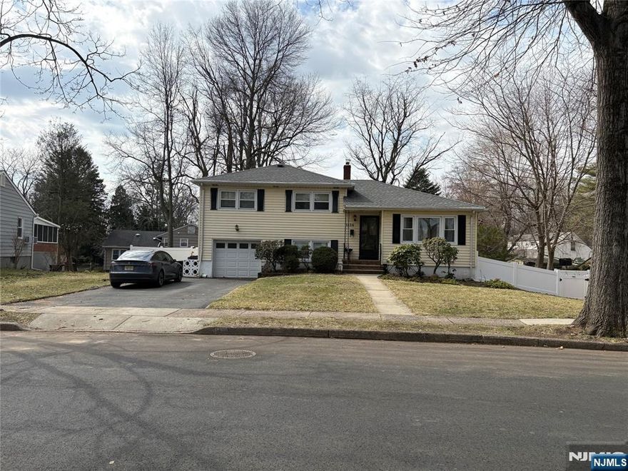 Beautifully renovated split level house located on quiet, a desirable neighborhood. 3 bedrooms 2.5 bath. skylights, hardwood floors. Newer kitchen with Sliding glass door to the bi-level terrace brings a view of nature into the living. Ground floor has den/office, laundry,1/2bath and back door with direct access to patio. The basement is full. Close to NYC transportation, major highways, schools, park and shopping. All fenced backyard. !!!!