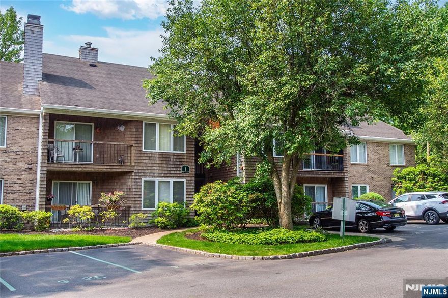 Don't miss this immaculate Two Bed//Two Full Bath desirable second floor End Unit in the Tranquil Tulip Gardens Community. Luxury wood look vinyl flooring through out, vaulted ceiling with recessed lighting and an abundance of closet space and natural light. Highly functional kitchen with plenty of cabinets, Granite counter tops and marble flooring. Newer appliances, In-unit laundry. Living room with appealing Fireplace "as is" with no known issues. Currently converted with electric insert. Sliders to quaint balcony that overlooks the courtyard. Perfect spot for your morning coffee or evening relaxation. Dining area spacious enough for entertaining. Primary Bedroom has walk in closet with attic for storage. Bonus storage bin located in exterior garage area is also included. Walkable to Wilmore Road Memorial Park, Town Center Shops and Eateries. NYC Bus steps away. NYC train short drive to Montclair. Close to all Major Hwys and Shopping. You are sure to fall in Love!