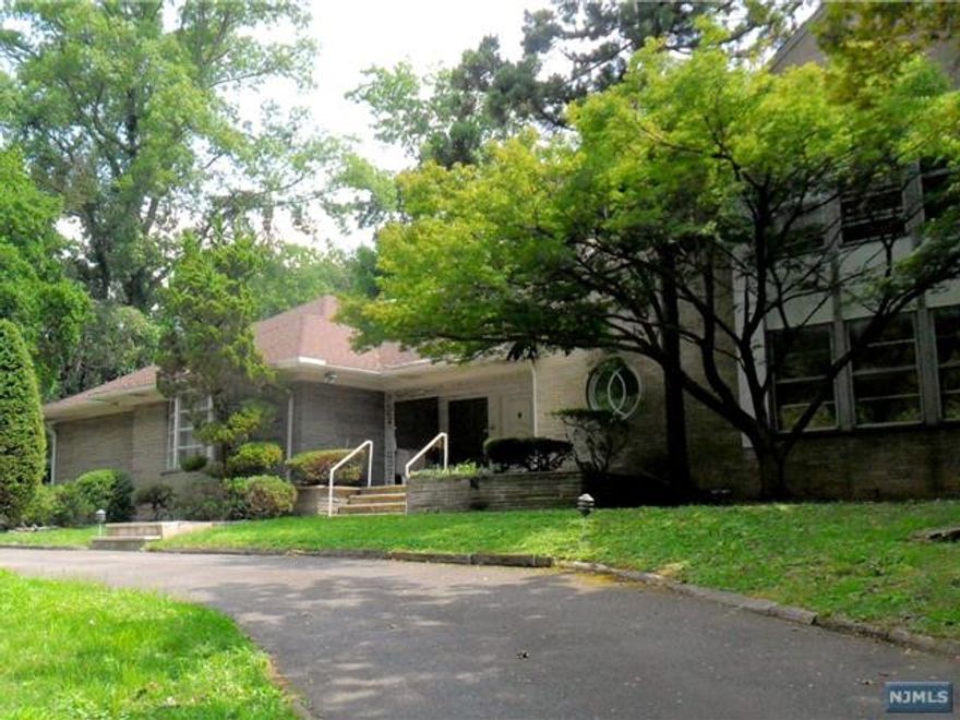 The single most sought-after property in all of Englewood! This Mid-Century 2-story home is walking distance to all that matters to homeowners. This was a builder's own home when constructed and it still maintains many of the original features. An enormous living room will make you think you've accidentally walked into a ballroom. The dining room is perfect for large get-togethers. There's a bar and library with a fireplace. The downstairs also has 2 bedrooms and 2 full baths. A very large kitchen with breakfast area has an enclosed atrium that opens to a garden with two tiers of flower. A third tier has a huge pool and cabana. Behind the pool is another 1/3 acre of trees. Upstairs has a master bedroom with a full bath. There are 2 more bedrooms upstairs, one with a fireplace. There's a large upstairs laundry room. Above the garage is a full guest quarters complete with a living room, bathroom, bedroom, and a sauna.