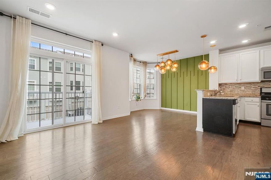 Call 732.789.0670 to schedule a tour. Your home search ends here!Experience a convenient lifestyle at one of the most sought after communities in Bergen county. Step into your beautiful townhme to exp bright & spacious interior featuring an open floor plan.The home is tastefully updated on all levels featuring 3 large bedrooms with two BEDROOMS FACING SPORTS FIELD, 2.5 baths w/2 car parking. 2nd floor features an open modern kitchen w/custom white cabinets, pantry, pendant fixtures, energy efficient SS appliances, dining with premium chandelier & huge bay windows, half bath & a sun-filled living room w/ PATIO. 3rd Floor features super spacious master Bedroom with high ceilings & large windows plus remote controlled fan & lights, Master closet w/ custom shelving, master bath w/ luxury soaking tub, 2nd & 3rd bed w/ walk-in closet & SPORTS FILED VIEW . Bonus features - RO water system installation for clean water, smart doorbell, full home automation, custom built in closets and much more