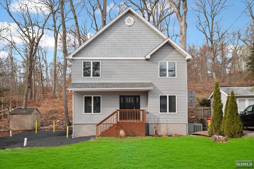 Located in the Greenwood Lake neighborhood, this fully renovated 2 bed/ 1.5 bath home is completely move in ready. Step in to the main level of the home with brand new flooring and recess lighting throughout. Kitchen features quartz countertops and brand new stainless steel appliances. This level also offers a half bathroom, and an open dining/ living room with lots of natural light. Upstairs, this home has 2 spacious bedrooms and a full bathroom. Driveway newly paved and new washer/ dryer included.