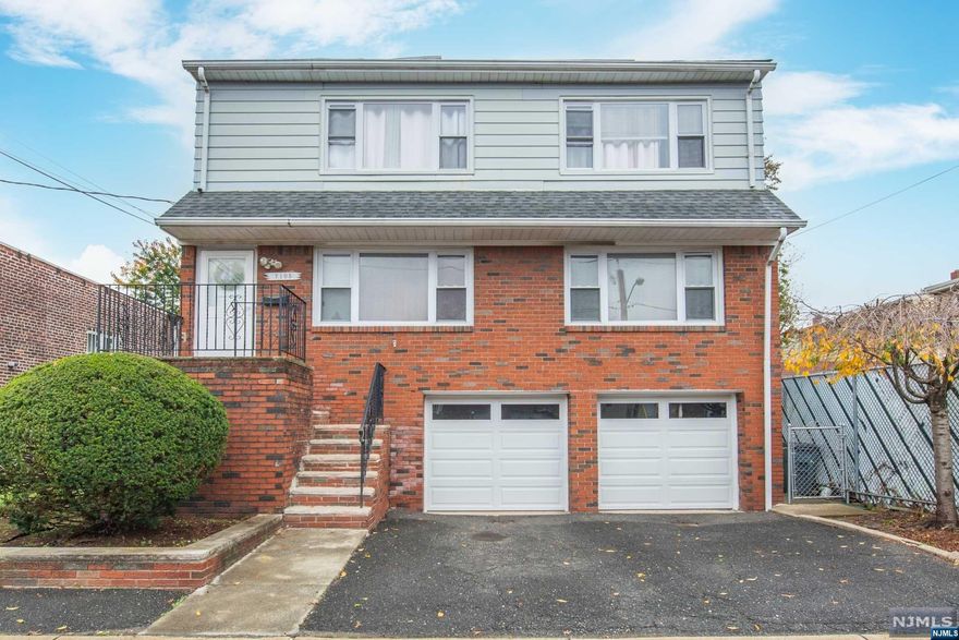 This incredible two-family property presents an exceptional opportunity! Two spacious & well-maintained units with newly-finished hardwood floors throughout. Complete with a walk-out basement, two-car garage/driveway for effortless parking, and large backyard, makes this home a dream for both homeowners and investors. Situated in a prime location, you'll find yourself just a block away from NYC transportation & easy access to schools, shopping, and major highways. New roof & sidewalks installed in 2022. This is your opportunity to own a versatile property that combines convenience, comfort, and the potential for strong, proven rental income! Being sold strictly As-Is - HIGHEST & BEST BY TUESDAY 10AM (11/14)