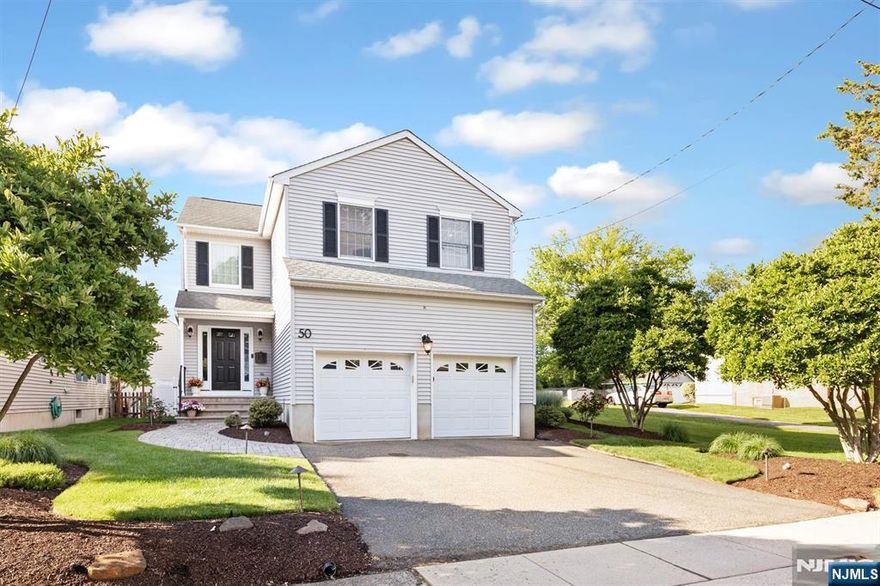 Welcome to this immaculate 2001-constructed home in the highly desirable Oakview section of Bloomfield. This elegant side-hall Colonial features soaring ceilings in the living room, creating a bright and airy atmosphere the moment you walk in. Hardwood floors run throughout the home, adding warmth and timeless style. The thoughtfully designed floor plan is ideal for modern living and entertaining. First floor includes a formal dining room and an updated eat-in kitchen that opens to a cozy family room with a wood-burning fireplace. Beautiful crown molding enhances many rooms. Sliding doors from the kitchen lead to the expansive deck. Upstairs, the spacious primary suite offers a walk-in closet and a luxurious en-suite bathroom with double sinks, a separate shower, and a Jacuzzi tub. Three additional bedrooms provide generous space and ample closets. A convenient second-floor laundry room makes chores a breeze.The expansive basement features high ceilings, offering endless potential for a media room, gym, office, or play area. Outdoor living is just as impressive, with a paver walkway, large back deck, and backyard paver patio ideal for relaxing, entertaining, or dining al fresco in your fully fenced yard. All of this, just steps from NYC transportation and located in one of the area's most sought-after neighborhoods. Easy access to downtown Bloomfield, Montclair and Route 3. A truly rare find!