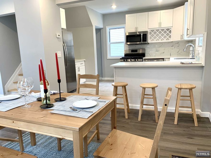 Nice Cozy 2 bedroom and 2 bathroom colonial style home. Enter the entrance to a decent size foyer. The living room, dining room, and kitchen have an open concept with recess lighting. Foyer, living room, dining room have luxury vinyl plank. The kitchen have all new appliances with an island, wood pattern floor tile, tiled back splash. 2nd floor have 2 bedroom with hardwood floor and decent size closet. Updated luxury full bath and shower in the second floor. Basement is finished with full bath. outside contain a one car garage with a patio about the garage. nice open backyard. The house has brand new drywall, roof, windows, doors, trims, central heat and A/C. New water heater