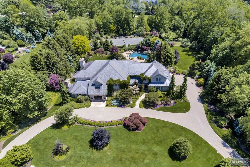 NEWLY RENOVATED, SENSATIONAL STONE AND SLATE COLONIAL ON 2 GATED FLAT ILLUMINATED ACRES WITH SPECIMEN PLANTINGS AND MANICURE GROUNDS WITH BOTH POOL AND TENNIS COURT!! THIS HOME IS DESIGNED FOR BOTH FORMAL AND INFORMAL FAMILY ENTERTAINING! FIRST FLOOR FEATURES GREAT ROOM/FPL, HUGE FORMAL DINING ROOM, BILLIARD ROOM/FPL WITH WINE ANNEX. LARGE RENOVATED CHEF'S KITCHEN WITH BREAKFAST ROOM/FIREPLACE, AND FAMILY ROOM. FULL ATTACHED AUXILIARY KITCHEN WITH AUTOMATIC ROLLER WINDOWS SERVICING THE REAR PATIO W/CUSTOM DESIGNED BBQ ISLAND WITH PIZZA OVEN. INCREDIBLE MASTER SUITE/SIT RM/WARDROBE CLOS./TERRACE/FPL. W/NEW BATH. 4 ADDITIONAL BEDROOM SUITES W/4 NEW BATHS COMPLETE THE 2ND LEVEL. LARGE ROOMS AND HIGH CEILINGS THROUGHOUT. HUGE, NEWLY FINISHED LOWER LEVEL W/STAFF QUARTERS. VERY WELL APPOINTED, AND MAINTAINED. VERY BEST ALPINE LOCATION! SEE BROCHURE FOR FURTHER DETAILS.