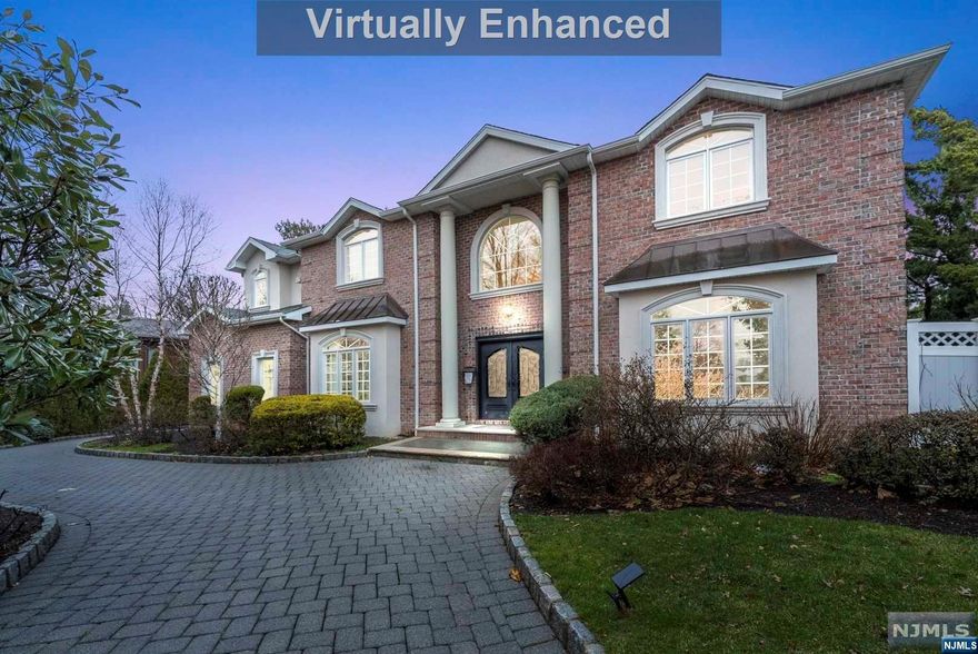 Live without any compromises. Welcome to this Grand Center Hall Colonial in the exclusive North Cliffs section of Englewood Cliffs. This 5 bedroom 6 full bath and 2 half bath with 3 car garage home sits on an oversized lot measuring 100x125 featuring 8077 sq feet of living space. The first floor features an immense foyer, living room, great room, office, 2 power rooms, bar, formal dining room, kitchen with breakfast nook, laundry room and a bonus den that can be converted into a 6th bedroom, butlers pantry and access to your 3 car garage. There are 2 sets of staircases that lead to the 2nd level which features 4 bedrooms all en suites. The Master Suite includes his/her walk in closets and a sitting area. The basement showcases a gym, full en suite bedroom, recreation room and a huge sauna with a shower located right outside your sauna.