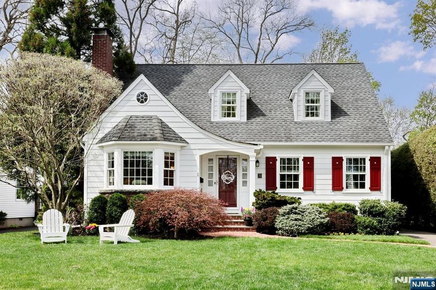 Sitting pretty on one of the most coveted streets in Glen Rock as if it were plucked from the pages of a fairytale, is this thoughtfully expanded 5 bedroom, 3 full bath home. Meticulously updated, you will be charmed from minute one. Starting with the perfectly landscaped front yard, paver walkway, and foyer leading to a large living room with gorgeous architectural details, gas fireplace and hardwood floors. Continue to the dining area leading to the open concept, renovated kitchen with custom cabinetry, quartz counters, and SS appliances-ideal for entertaining. Leading off the dining area is a bright den flanked with windows, with easy access to the private backyard as well as one car garage and driveway. The first level continues with a full hall bath, sizable Bedroom # 1, Bedroom # 2 used as an office, and ample closets throughout.The 2nd level features the Primary Bedroom Suite with large walk in closet, expansive Primary Bath and other storage nooks. The 2nd floor continues with a full hall bath, Bedroom # 4 and charming Bedroom # 5 complete with an attached room that can be used as a playroom, or additional oversized closet.The lower level offers an expansive partially finished basement with rec room, laundry, storage-the possibilities for the unfinished portion are endless.The backyard is your own private oasis with plenty of room to relax or gather. Close to Glen Rock's highly rated schools, NYC transportation and more, 70 Ridge Road is where your story begins!