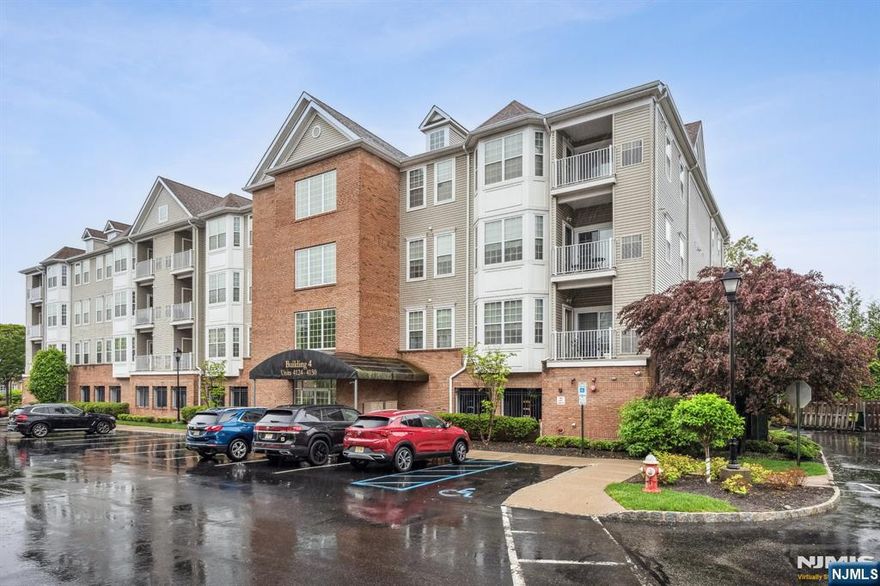 Welcome to building 4, a fantastic corner unit on the 3rd floor at Altair, an Adult Community. This elegant one-level unit, complete with wood laminate floors, features an entry foyer that boasts an open-concept kitchen with granite countertops, stainless steel appliances, breakfast bar, and a spacious pantry and laundry room. The living room includes a bow window that invites plenty of natural sunlight and flows to a tranquil private balcony. The primary bedroom suite is designed for relaxation, complete with a custom built California closet, additional closet, a linen closet, a private full bathroom and access to the terrace overlooking lush, wooded greenery. An additional bedroom, also with a custom California closet and full bathroom, provides versatility for guests or a home office. This unit also includes covered parking for one vehicle and a storage locker. The complex features a clubhouse with a party room, kitchen, library/card room, exercise room, and an inground heated pool, hot tub, and walking paths. One pet is permitted 30 pounds or less. This is a smoke free complex.