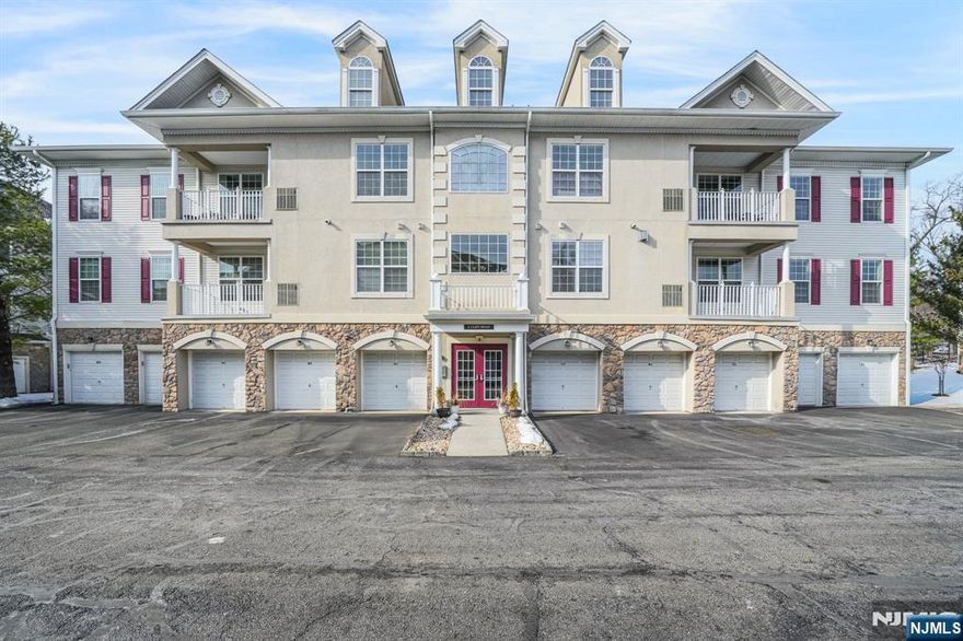 Welcome to this spacious one-floor condo in Four Seasons at Great Notch in Woodland Park. This well-maintained two-bedroom, two-bath home offers an open layout designed for comfortable everyday living and easy entertaining. The living room features a gas fireplace that creates a warm focal point, perfect for quiet evenings or gathering with friends. The kitchen includes a breakfast bar that flows into the dining and living areas, making it easy to cook, host, and stay connected. A blend of wood, tile, and carpeted flooring adds comfort and functionality throughout the space. The primary bedroom is generously sized with abundant natural light, a walk-in closet, and a private bath featuring a soaking tub and separate stall shower. A second bedroom and full bath provide flexibility for guests, a home office, or additional living space. Located in an elevator building with a one-car garage, this condo offers true single-level living with minimal exterior maintenance. Community amenities include a clubhouse, billiards room, exercise room, kitchen facilities, multi-use sports court, indoor pool, outdoor pool, sauna, and more, creating opportunities to stay active, socialize, and enjoy low-maintenance living. Conveniently located near Montclair shopping, restaurants, and entertainment, this home is ideal for buyers seeking a Woodland Park condo with one-floor living, garage parking, elevator access, and resort-style amenities all in one established community.