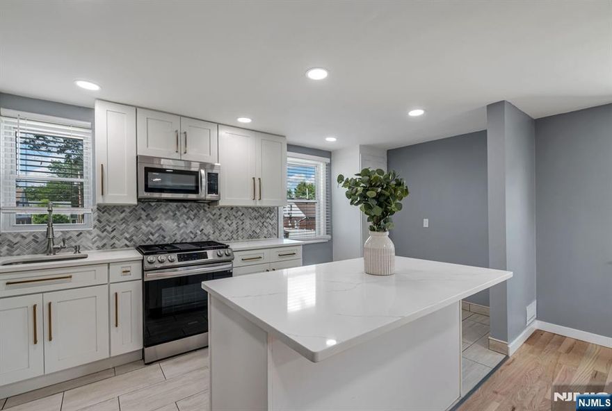 Look no further. This beautifully renovated 2-bedroom, 1-bath second-floor unit exudes modern elegance and comfort. As you step inside, you'll be greeted by brand new hardwood floors that flow seamlessly throughout the space. The heart of the home, a stunning new kitchen, boasts luxurious quartz countertops, a spacious center island perfect for meal prep or casual dining, and sleek cabinetry that provides ample storage. The updated bathroom features contemporary finishes, ensuring a relaxing retreat. Situated in a prime location, this unit offers the convenience of being close to public transportation and vibrant downtown shops, making it perfect for both commuting and leisure. Don't miss the opportunity to make this exquisite rental property your new home!