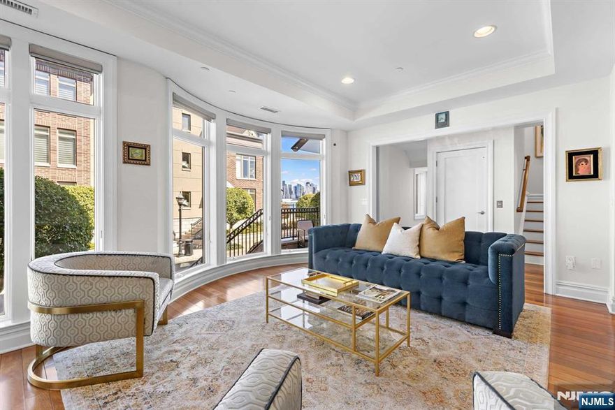 Vibrant and genuinely comfortable, 3 Oxford Landing fulfills your desire to live peacefully in a distinguished neighborhood near Manhattan. This meticulously maintained home boasts a 3,140 square foot floor plan, offering a balanced layout with four true en suite bedrooms upstairs, away from your private two-car garage. The open and airy living areas are complemented by multiple terraces. You'll love the home theater, and the home features choice appliances and upgrades throughout, including a whole-house water softener and a reverse osmosis system in the kitchen for amazing water quality. Everyday living is made easier with the convenience of a private elevator. 3 Oxford Landing is a proud member of Henley On Hudson, a well-manicured, community of luxury homes whose amenities include a concierge, swimming pool, two fitness centers, children's playroom and cinema. Residents relish the direct access to the New York Waterway and unparalleled views of The Greatest City in the World