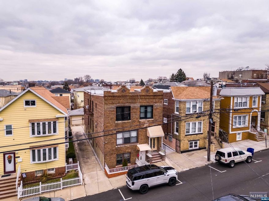 BOM. You cant miss this one. Location !!, Location !!, Location !!. Close to Shopping, Bus, Park & School. Amazing opportunity to own a fantastic legal 3-Family home with bonus finished basement. Property its an Move in Condition, Home also offers multiple tandem parking spaces with 3 Car Opener Garage. Rent out entire home or be an owner-occupant with tenants! Perfect location for commuters. Must see to appreciate the size and potential of this massive home