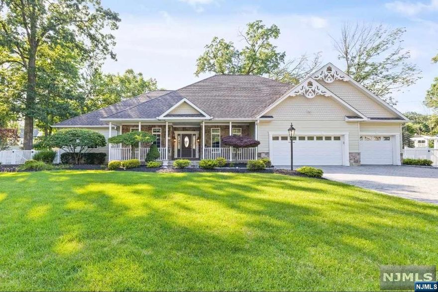 Welcome home to this beautiful 4 bedroom, 3.5 bathroom, 3 car garage custom built home located in the desirable Packanack Lake community! First floor features spacious eat-in kitchen open to beautiful living room w/ hardwood floors, gas fireplace, cathedral ceiling & skylights. First floor also offers primary bedroom w/ walk in closet, 2 additional closets and ensuite bathroom w/ jetted tub and stall shower. Another large bedroom is also located on the first floor w/ ensuite bathroom. Second floor features hardwood throughout, two bedrooms and one bathroom w/ granite countertop. Large walk-in attics for plenty of storage! Unfinished basement with lots of room to create your dream basement! Home also features generator hook-up, HW heater 2021, surround sound inside the house, central vac, timed ground lights outside, underground sprinkler system and much more! Enjoy Packanack lake amenities such as 2 beaches, fishing, swimming, ball fields, marina, clubhouse & golf/tennis available