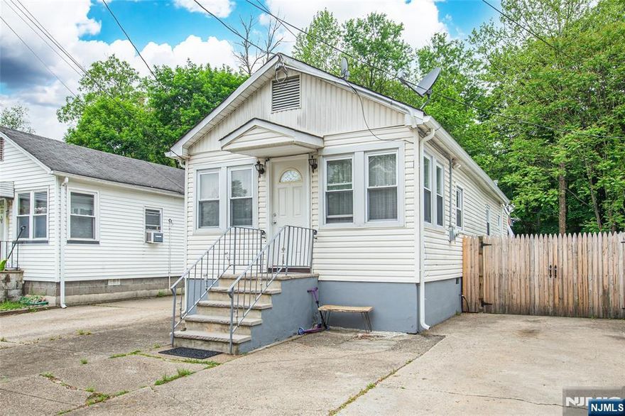 Charming and updated ranch in an inviting neighborhood, offering modern comfort and style. This 2-bedroom, 1-bath home features updated flooring, a remodeled kitchen with white cabinets, a renovated bathroom and bedrooms. The fenced backyard with a Trex deck is perfect for entertaining and relaxing. Lots of storage in the attic and outdoor shed. Convenient to parks, highways and shopping. Perfect for a starter home, for downsizing or a condo/apartment alternative. Move-in ready and beautifully maintained! Brand new septic. Flood insurance required.