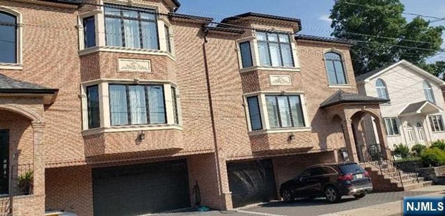 All Brick oversize Duplex features living space over three floors, Ground level includes two car garage, family room or bedroom ,full bath , with separate entrance, first floor is highlighted by beautiful modern eat-in kitchen with stainless steel appliances, deck and spacious living area, second floor features master bedroom ,2 bedrooms ,full bath , and laundry. Location offers minimal distance to NYC transportation, schools, parks, shopping, restaurants, and major highway's, Do not miss out on a spectacular home. available DEC/1/2025.