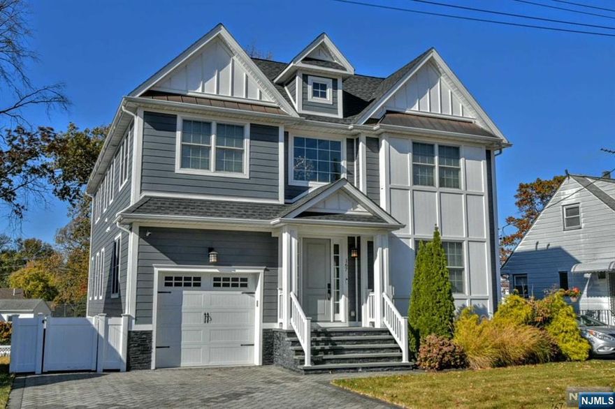 Step into elegance with this beautifully designed custom built home, featuring a bright welcoming foyer, intricate tile flooring and an inviting living space perfect for relaxation and entertaining. The thoughtfully designed gourmet kitchen with Viking appliances, quartz countertops and island seating, are what the most discerning chefs desire. Open concept to the family room making holidays and get togethers delightful. A first floor ensuite bedroom lends itself to multigenerational living. Step through the french door onto a lovely deck and patio below. Upstairs, awaits a primary suite retreat with a warm fireplace, luxury bath and a walk in closet of your dreams. Three large bedrooms, full bath and laundry room complete this level. Finally downstairs is a theatre room with wet bar, a guest suite with full bath and walk out french doors to the yard.