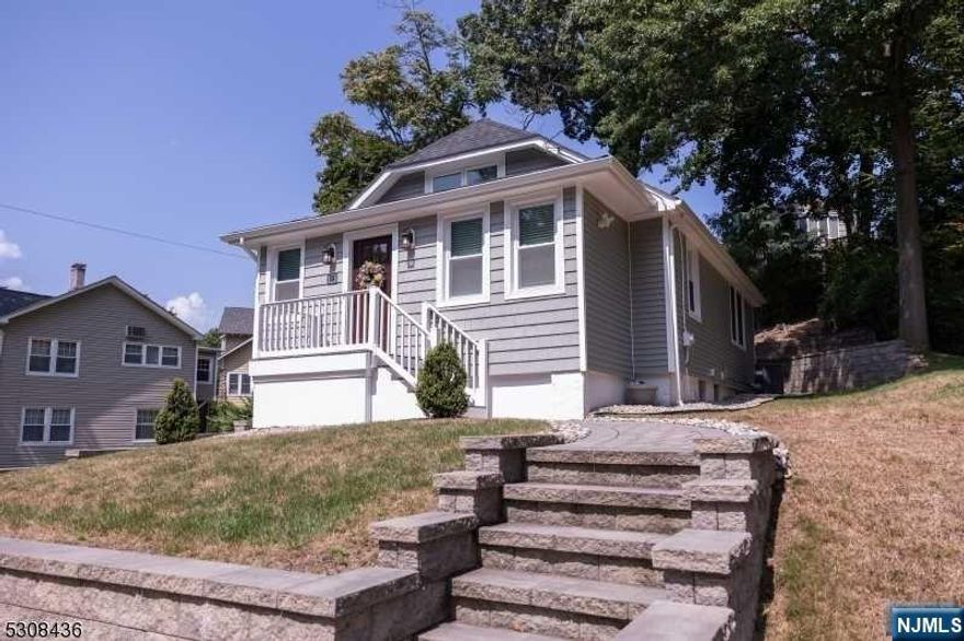 Gorgeous, totally renovated home ready to move right in. Features include -first floor-entrance-heated porch, living rm with fireplace, dining room, kitchen/granite countertops/stainless appliances, bedroom, full bath. Second level includes primary suite/powder room. Huge walkout basement, lovely yard plus two car detached garage,convenient location-near NYC trans, shopping, restaurants, etc. This is the one you've been waiting for at a very affordable price!!