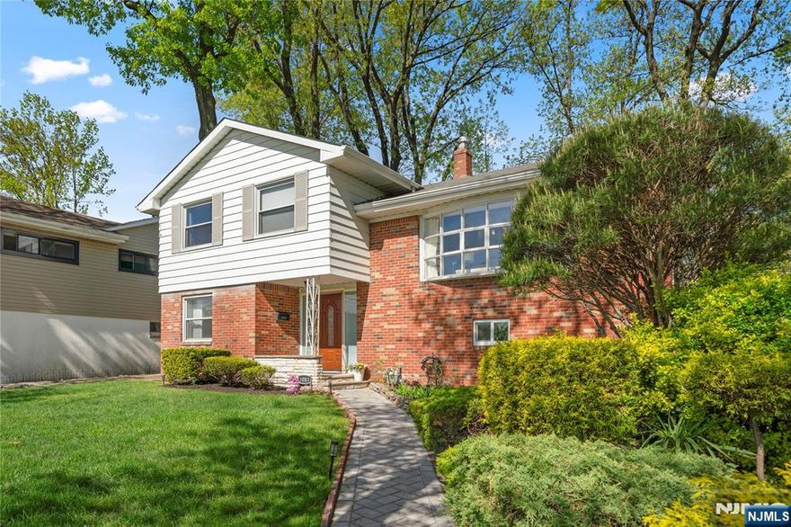 Beautiful three bedroom two bath with office room split level Corner property facing east very bright home. Family room with a Fireplace hardwood floors living room with high ceilings. Open kitchen with modern tiled baths, great fenced backyard, attached garage , gas heat central air laundry room. Great location very convenient for public transportation (walking distance to NYC buses),schools,shopping and park(next to the Inwood Park).The fireplace can't be used