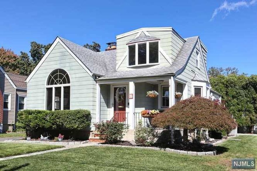 Welcome to this lovely Cape with charming front porch located on a lovely residential street. Enter through an inviting foyer and sun filled living room with cathedral ceiling and fireplace. Formal dining room, eat-in-kitchen with granite countertops. First floor master bedroom has double closet, second bedroom has sliding glass doors leading to a private oversized deck. Large third bedroom located on second floor and additional storage. Basement has finished rec room/office, powder room, storage space/workshop and laundry room. Central AC, 200 amp electric, underground sprinklers, hardwood floors, and more. One car garage with plenty of parking for 5+ cars. NYC Express bus one block away. Close to schools and shopping. A must see! Call today to schedule a viewing!