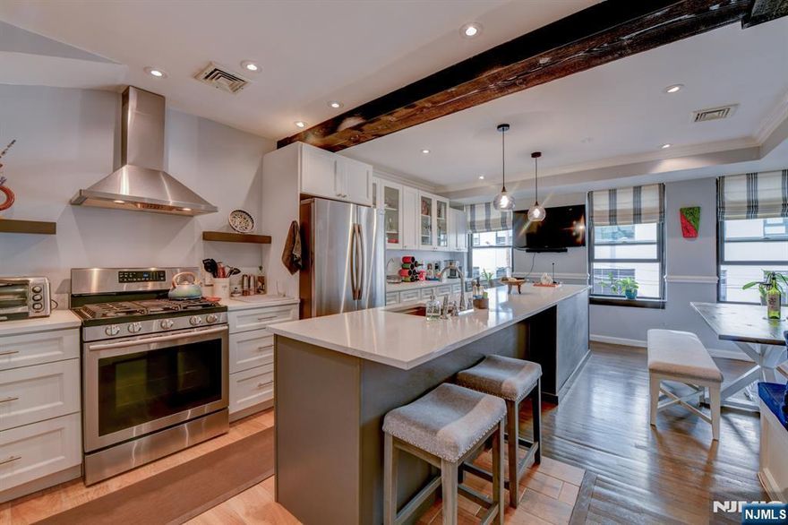 Location, Location, Location, commuters dream and perfect for those looking to be in the heart of the Ironbound, approximately 2 blocks to Newark Penn station and Ferry st., near Prudential Center. Beautiful Three level apartment with three bedrooms absolutely gorgeous modern eat in kitchen with island and custom built banquette, in unit laundry. One of the few units that has view to court yard. courtyard is a beautiful area where residents can BBQ, entertain or just hang out and relax. There is indoor parking. Convenient to local shopping, restaurants, entertainment, major highways, Newark airport and much more...This home is in excellent condition, wonderful opportunity nothing like it in the area.