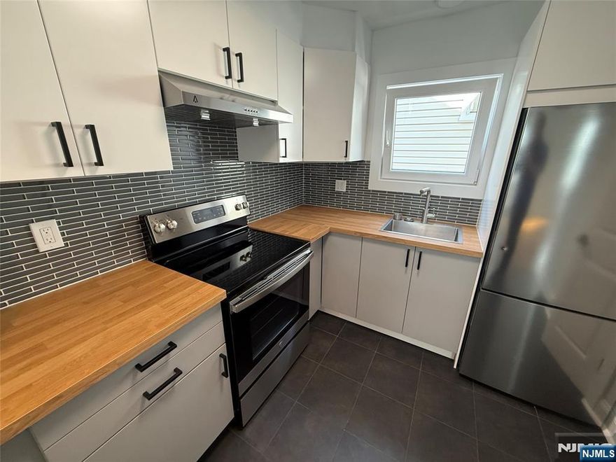 Absolutely stunning two floor unit is now available for rent in Garfield, NJ. Property offers the following; 2nd floor; 2 Bedrooms, where one offers access to deck, large living room, dining room, kitchen and full bathroom. 3rd Floor; bedroom, full bathroom and family room or additional bedroom, depending on your needs. There are storage area and laundry hook ups in basement. here is possible of driveway or/ and garage for an additional fee. Garfield offers free pre-school, unit is located on a great residential street near schools, parks and highways. Don't wait! Set up your appointment today.