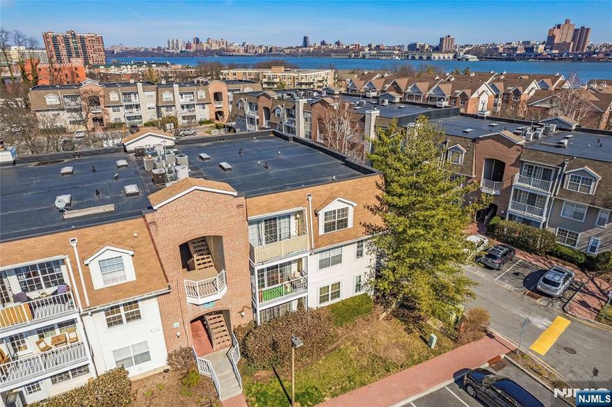 If you love a sun filled home look no further than this classy "Ashley" model. A corner unit with all three exposures: East, South, and even West. The entire home has been tastefully renovated. If you love a sun filled home look no further than this classy "Ashley" model. The entire home has been tastefully renovated: Within the past 12 months, both bathrooms were gutted and had plumbing replaced, to install ALL Porcelanosa stone tiles in the walk-in showers. These Earth tone stones are 47"x 47" in size for each of the showers. These Earth tone stones are 47"x 47" in size for each of the showers w/matching stone tray floors. The flooring throughout was also just replaced with 6"-inch-wide, engineered wood planks, in sand tone. The rest of the look is caressed in white such as the floating white wall stand with drawers and cable management. An excellent touch to make this home a nice showplace. Enjoy year-round use of the south / southwest facing, tranquil terrace, that gets direct sun all day. The sun also drenches the master bathroom and the second bedroom. This home is super convenient too, as it's just one flight up and near the main entrance, plus has a low monthly HOA. Crown Village is a lovely tree lined community that has a nice swimming pool, gym, and located and the lighted cross walk on River Rd.. Extra parking is available for just $70 p/month. A great home awaits the next loving owner.