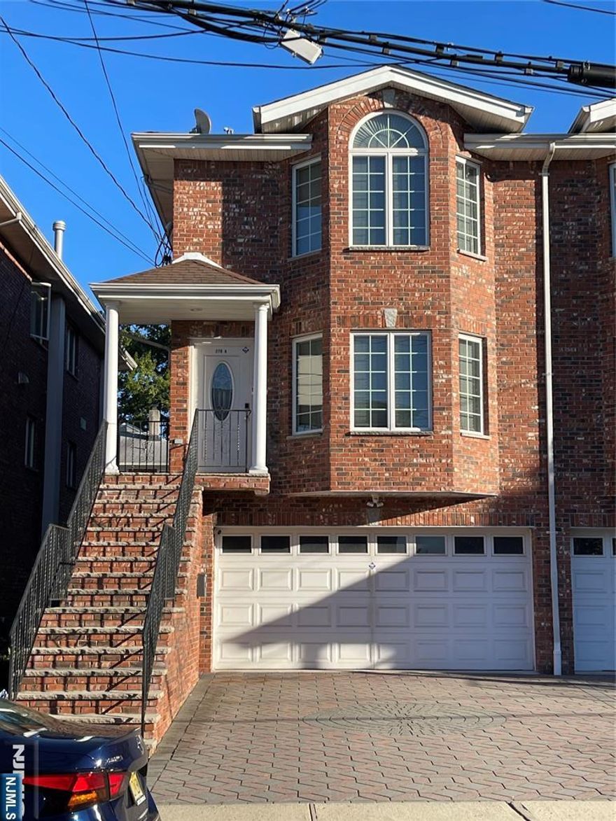 PICTURE IS WORTH THOUSAND WORDS. BEAUTIFULLY MAINTAINED DUPLEX LOCATED WITHIN WALKING DISTANCE TO BROAD AVE. 2 CAR GARAGE.