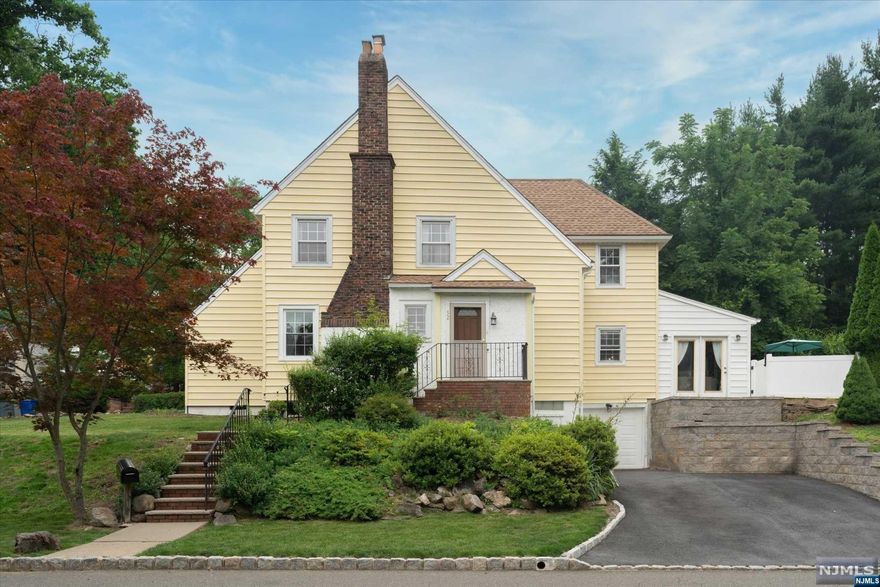 Welcome to this absolute gem nestled in the peaceful Redwood section, a spacious corner-lot Colonial, perfectly balancing vintage charm with modern convenience. An inviting living room, boasting a wood burning fireplace is flanked by the sunroom and dining room that opens to the fresh white kitchen, complete with a large center island. The sun-filled family room opens to the fenced yard with a paver patio. A powder room finishes the first floor. There are three bedrooms on the second floor, with an updated hall bath. A versatile finished basement features a den, storage, and an additional full bath perfect for a home office or guest suite and has access from the garage. With the NYC bus stop a brief walk away, and swift access to the 280, plus proximity to Upper Montclair train station, this sunny & spacious home is stylish and full of character.