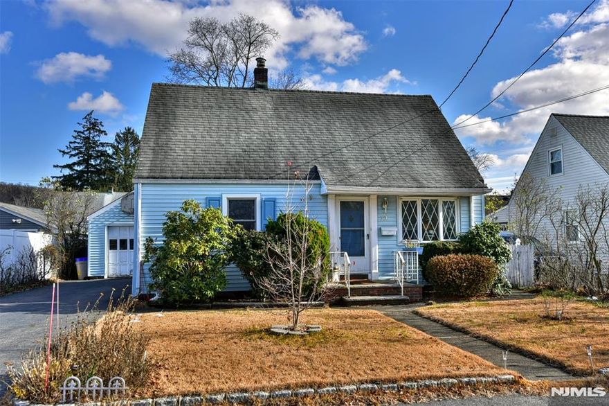 SAY YES TO THE ADDRESS! Welcome to the close-knit town of Haskell in Wanaque Borough! Nestled into this true Suburban NJ neighborhood sits this charming 3 Bedroom, 1 Bathroom Cape Cod with DETACHED GARAGE. HARDWOOD FLOORS UNDER CARPETS! The large FIRST FLOOR PRIMARY BEDROOM has a wall of closets (room to add a bathroom if desired)! 2 more cozy bedrooms and a linen closet make up the 2nd floor. You will be surprised by the OVERSIZED EAT IN KITCHEN with laundry room and plenty of room to to bring your design visions to reality! The basement currently houses the utilities and is a crawl space which is typical of the neighborhood. Many neighbors have dug out to make a larger usable basement space. NATURAL GAS, PUBLIC WATER, PUBLIC SEWER. The detached garage is a great space for a workshop or equipment and has ample yard space behind and next to the garage. Plenty of room in the yard to play, relax. and entertain! Wall AC unit in Primary bedroom is not working and is being sold AS IS. This gem is a must see in a wonderful welcoming neighborhood!