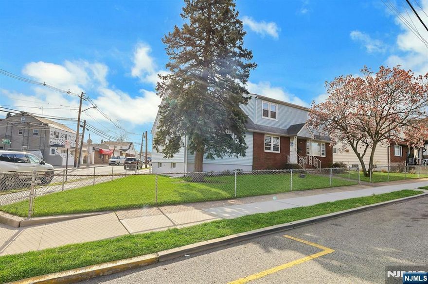 Expanded two family on a corner lot with parking for 7 vehicles. 2 car attached garage with loft and 5 driveway spaces. Vacant first floor has a large, newer kitchen with quartz countertops, refrigerator and dishwasher. Enter into the family room from the driveway. Large Living Room with tile flooring. 2 good size bedrooms, newer main bath and Huge primary bedroom w/ half bath. Second floor was completely renovated less than 2 years ago, new kitchen, bath, new flooring at that time. Full basement with outside entrance, semi-finished, w/bar, full bath, summer kitchen, utilities, 2 sets of laundry hook-ups. Fenced lot with patio area, gazebo and storage shed. Grammar school down the block, one block to Midland Ave. shopping and restaurants. Easy commute to Plauderville Train Station.