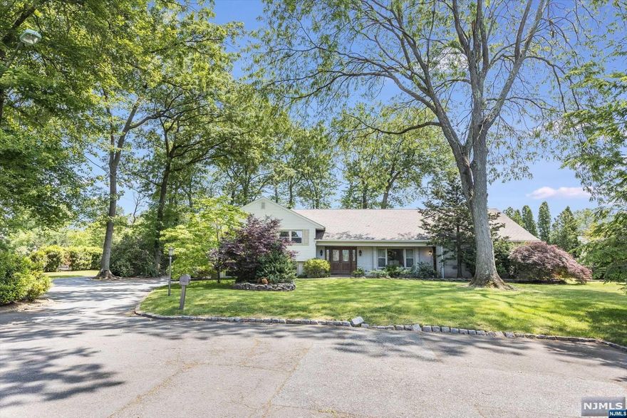 Prepare to be pleasantly surprised as you enter this home, situated on over 1 acre!.Located on the cul-de-sac, home offers appx 5,000+ sq ft of space. Lge entry foyer leads to spacious LR, DR, FR, EIK, full BA and laundry room, which make up the main level. 2nd flr offers the primary suite, w/walk-in closet, 2 dble closets and full BA. 3 addtl BR's and another full BA round out this level. On the 3rd flr, you'll find a private "apartment" with 2BR's, LR, kitchen, full BA and laundry. With an outside entrance or convenient access from both 1st and 2nd levels, this versatile space can be used as an in-law suite, au pair retreat, or extra living space. Finished lower level rec room, pwdr room and outside access awaits for leisure or entertaining. Full basement with outside access and high ceilings offer even more space! Escape to your backyard oasis to the incredibly lge deck complete w/BBQ area, in-ground pool and ample yard space to host gatherings or retreat to enjoy the outdoors!