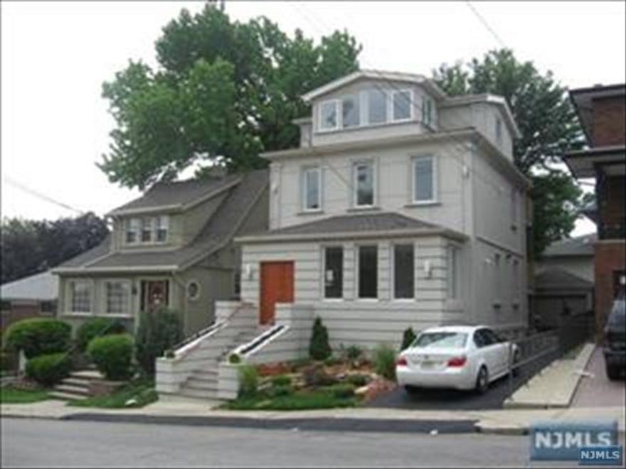 Are you looking for a fabulous living, with three bedroom two full bath, two car garage use of the yard, modern bathrooms, elegant gourmet kitchen, Brazilian beautiful floors laundry in unit and two levels of living space? Here it is!!! Renovated duplex apartment. First level comes with modern kitchen, open floor plan living and dining room area, large bedroom, beautiful full bath. Second level has two bedrooms, modern full bath, balcony with partial NY skyline views. Close to New York City transportation and shopping. Available on August 8th.