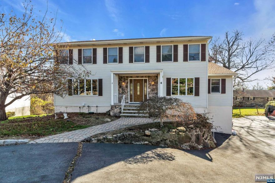 Magnificent colonial in prestigious Highview at Hawthorne. This lovely home offers 5 beds, 2.5 baths, a beautiful marble entry foyer, a formal living room, a formal dining room, family room with wood burning fireplace and private deck . A large eat-in kitchen with sliders to a deck with breathtaking views of the NYC skyline, large laundry room, full bath and bedroom complete the first floor. The second floor features a king-sized primary suite with a huge walk-in closet, primary bath with stall shower. Three oversized bedrooms and a full bath complete the second floor. A huge walk-out basement and oversized two car garage offer so much storage. This desirable community features tennis courts and a private children's park, minutes to beautiful Goffle Brook Park, all major highways, and NYC transit making this home the one that you Do Not want to miss! Call/TEXT today for a Private appointment. BUYER COULD NOT PERFORM. Property Back on Market! Will not last!