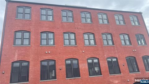 Photo of 38 Mill St, Paterson, NJ 07501 (MLS # 26009157)