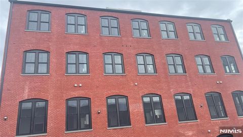 Photo of 38 Mill St, Paterson, NJ 07501 (MLS # 26009157)