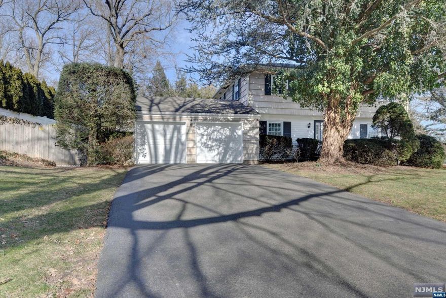 Welcome To 29 Winthrop Court! This Charming Center Hall Colonial Is Located At The End Of A Cul-De-Sac In The Very Desirable Borough Of Tenafly. The First Floor Offers An Eat-In Kitchen Feat Granite Counter Tops, Gas Cook Top, Electric Double Oven, & A Sub Zero Refrigerator. A Formal Dining Area, Powder Rm, & An Inviting Living Rm W/ A Wood Burning Fireplace Complete The First Level. The Second Floor Feat An Owners Retreat W/ A Walk-In Closet & En-Suite Bath, 3 Other BR's, & A Full Bath W/ A Jetted Tub & Corian Countertop. The Basement Has A Family Rm, A Storage Area, & A Workshop/Laundry Rm. A New Electrical Panel Was Installed In 2022 & The Boiler Is Newer As Well (Within The Last 5 Years). The Entire Home Is Grounded By A Full House Surge Protector. The Backyard Has A Patio & Plenty Of Privacy. The 2 Car Garage Provides Extra Storage Space. The Bus Stop Is Across The Street. Very Close Proximity To Schools, Major Highways, & Houses Of Worship. One Year Home Warranty Included!