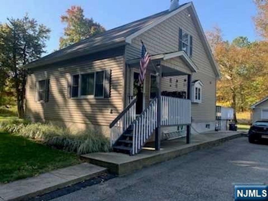 This charming updated home has it all. A beautiful Kitchen W/SS appliances and granite counters. Breakfast bar hardwood floors throughout, 2 gorgeous stone fireplaces 1 in the living room 1 on the back deck perfect for 3 season entertaining. A luxurious primary suite W full Bth W walk in shower W dual shower heads, sitting room, walk in closet and storage. 2 additional bedrooms, laundry, bath and 9 Ft ceilings round out the interior. The oversized 1 car garage is being used as the owner's gym w heat and A/C. The large level property is landscaped and completely fenced w lg storage and woodsheds. Ample parking for several cars. The property is adjacent the Morris County Park System Bike Trail which will soon be open to cyclists and runners. It also abuts the Pompton Riverwalk Trail W boat launch. Make this incredible home your own private oasis. More pictures coming soon. House is on 2 lots #5 is 100x155 tx 5094. #6 50x145 tx 177.