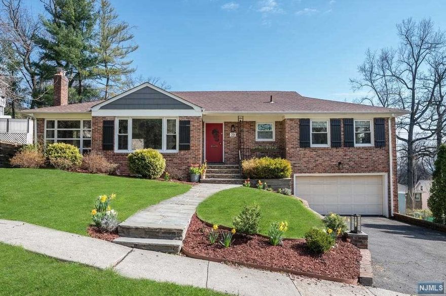 Spacious and bright Mid-Century Modern home nestled into the sought after Gregory neighborhood. Enter into the foyer of this welcoming floor plan and be creative with the oversized sun-drenched LR with striking large picture window. Relax in the family room where you can cozy up to the wood-burning FPLC or convert it to an office or play room. Entertain in the sizable FDR which extends into a spacious EIK with granite counter tops, open shelving and coffee bar. Easy access into the sun-room where you get a glimpse of NYC lights. Down the hallway are 3 large bedrooms, the primary bedroom has an en-suite bath and the main bathroom is large and centrally located. The lower level is partially finished and a great space for a play room/work space and has plenty of storage and laundry. The lower level walks out into the backyard which has a brand new 600' paver patio which enjoys both shade and sun. Jitney service NYC transportation and minutes from the South Mountain Recreation Center.