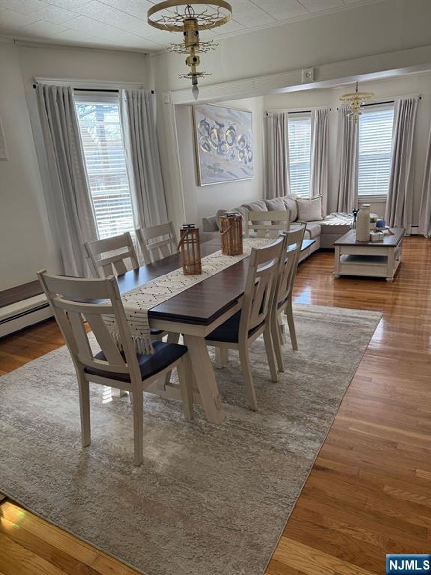 Income producing or investment two family located in a great section of Paterson. First and second floor units offers 3 bedrooms, 2 bathrooms , eat in kitchen, living room and formal dining room. Finished basement with full bath , finished attic with full bath . offers many possibilities for extended fam. Features hardwood floors , porch ,wood deck. Home sold As Is