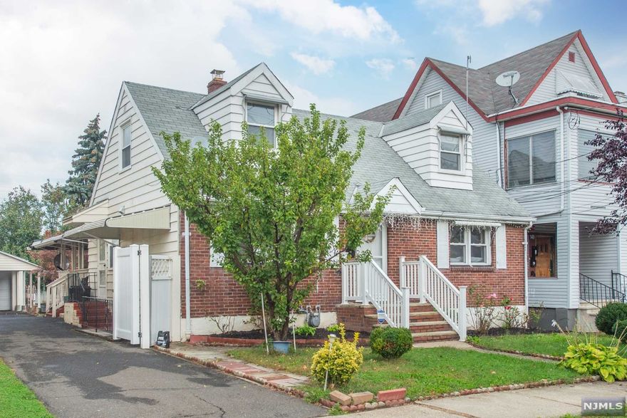 Enter unto this beautiful 4 bedrooms, 2.5 bath home with modernized features and a homey feel. This home features first floor: a Livingroom, Kitchen, Dinning room that opens to a large back deck that makes an extra space for hanging outdoors, a full bath and two bedrooms. 2nd floor: 2bedrooms and half a bath. The full finished basement with separate entrance has a family room, summer kitchenette, full bath, storage and laundry room. Backyard is beautiful and deep with a large paved area great for entertaining your guests, bonfires and having family BBQs. Be the place where your family and friends come together. The home also features a long driveway that easily accommodates three cars. it has a large one car garage with an additional work room in the back. Central AC and Heat installed in August 2018. Conveniently located close to major highway, walking distance from school 25 and shopping.